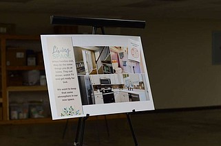 A poster-board in the new The CALL building shows the design plans for a new visitation space within the facility. This gives the biological parents of children in the foster system space to visit their kids.